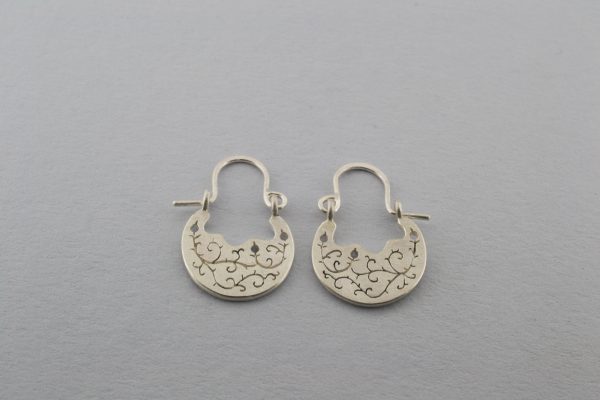 front of bramble earrings from a distance